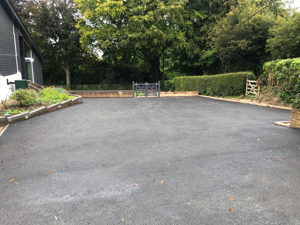 This is a photo of a bitumen driveway which is in the process of being installed by Springfield Lakes Surfacing Solutions